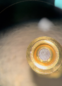 Microphotography of the filter-side of a bird-precision part